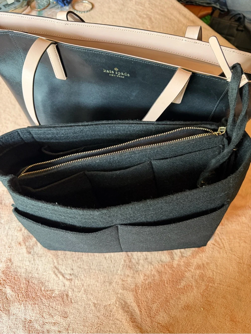 kate spade black tote with cream straps and floral charm